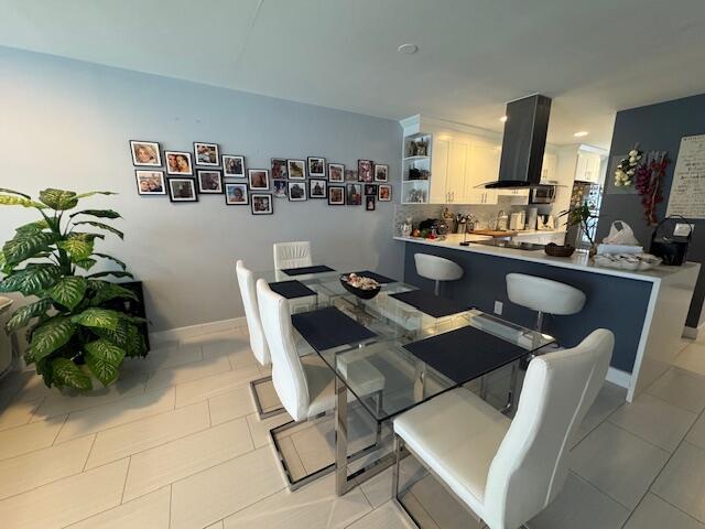 dining room with light tile patterned floors