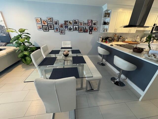 dining room featuring light tile patterned floors