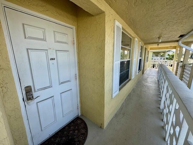 view of exterior entry with stucco siding