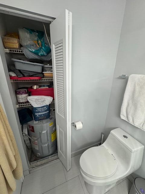 bathroom with tile patterned floors and toilet