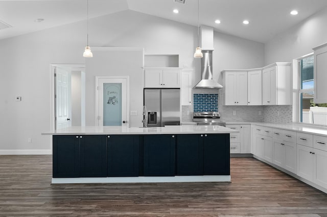 kitchen with white cabinetry, a center island, dark wood-type flooring, appliances with stainless steel finishes, and high vaulted ceiling