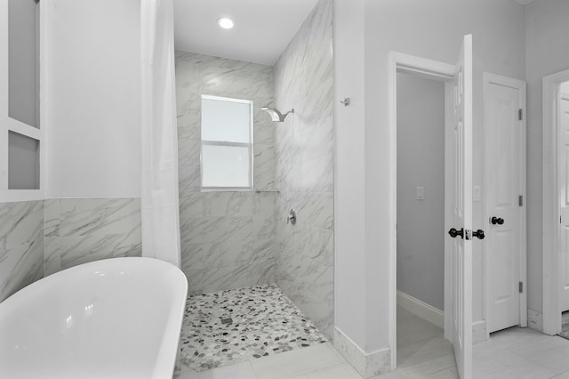 full bath featuring a marble finish shower, recessed lighting, and a freestanding bath