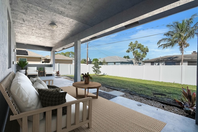 view of patio with an outdoor living space and a fenced backyard