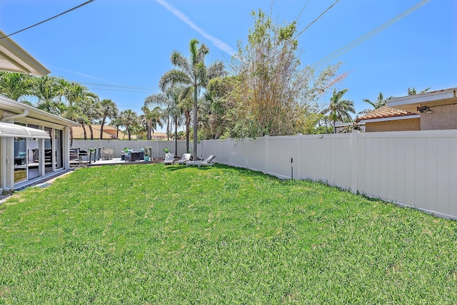 view of yard with a patio and a fenced backyard