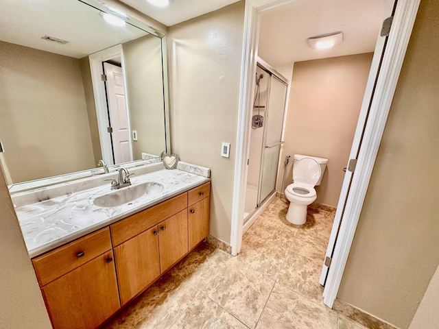 full bathroom with vanity, a shower stall, toilet, and visible vents