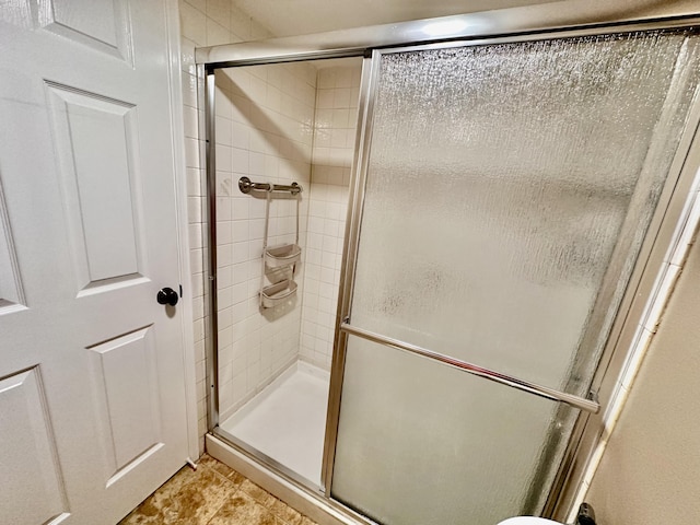 bathroom featuring a stall shower