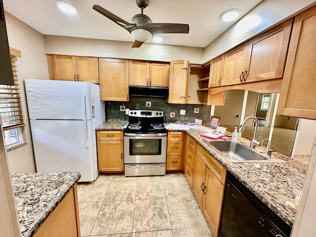 kitchen with under cabinet range hood, dishwasher, stainless steel range with electric stovetop, freestanding refrigerator, and a sink