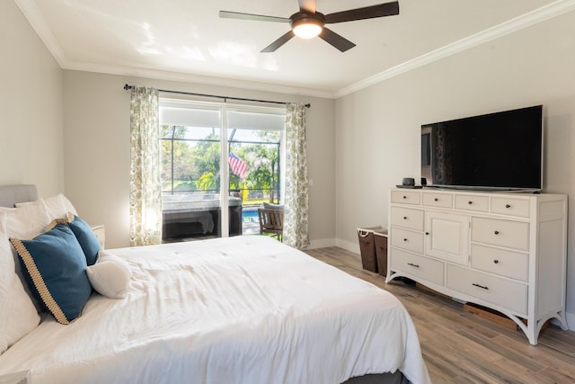 bedroom featuring ceiling fan, baseboards, light wood-style flooring, and crown molding