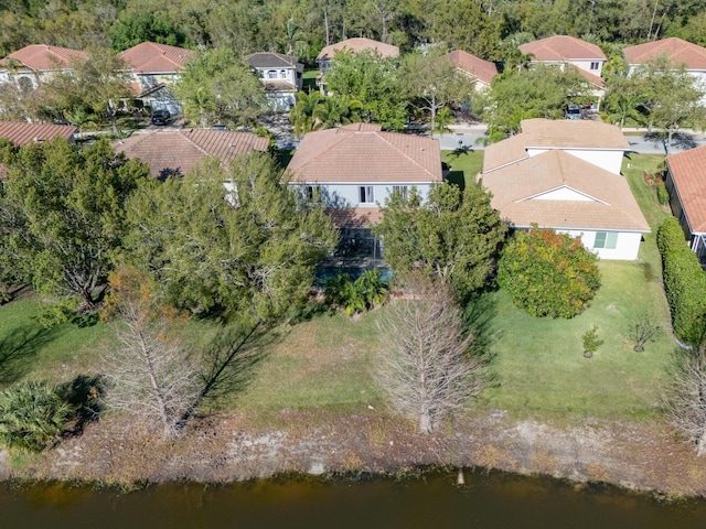 bird's eye view featuring a residential view and a water view
