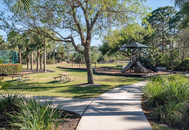view of community with a yard and playground community