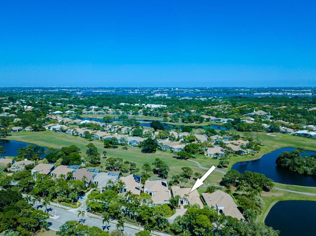 drone / aerial view with a residential view and a water view