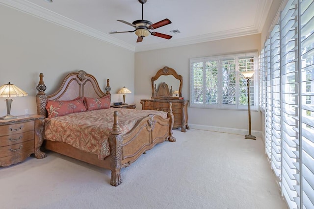 bedroom featuring visible vents, ornamental molding, baseboards, light colored carpet, and ceiling fan