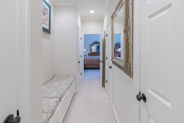 corridor with light carpet, recessed lighting, and crown molding