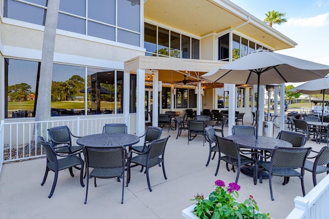 2488 SW Longwood Dr, Palm City, FL 34990 - view of patio / terrace with outdoor dining area and a balcony