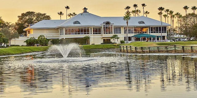 back of house with a water view