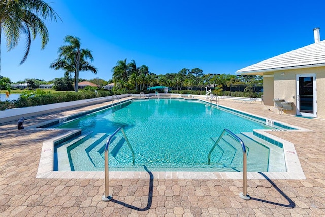 community pool with a patio