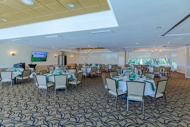 carpeted dining area with a notable chandelier and visible vents