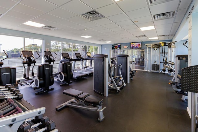 gym with visible vents and a drop ceiling