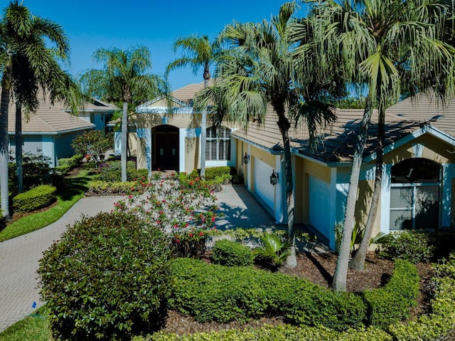 view of front of house with decorative driveway