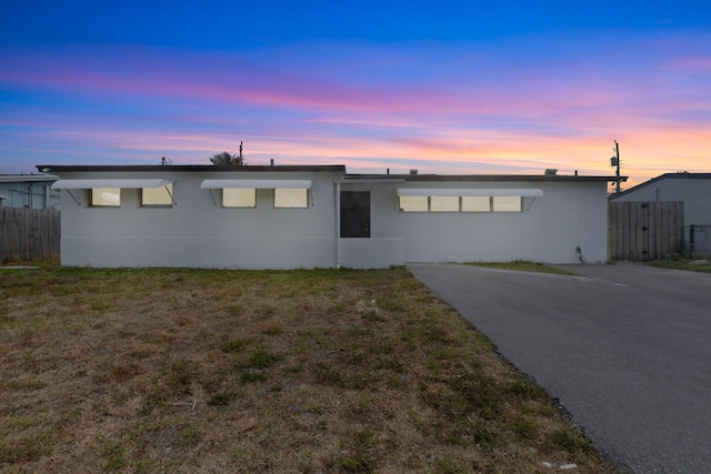 ranch-style home with stucco siding