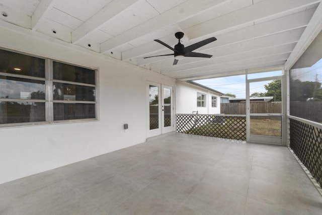 unfurnished sunroom with french doors and ceiling fan