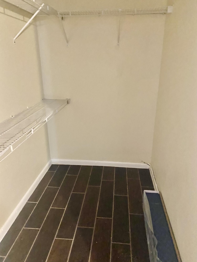 spacious closet featuring wood finish floors