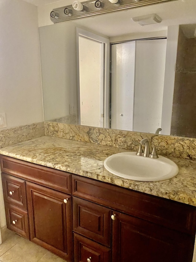 bathroom with vanity and tile patterned flooring