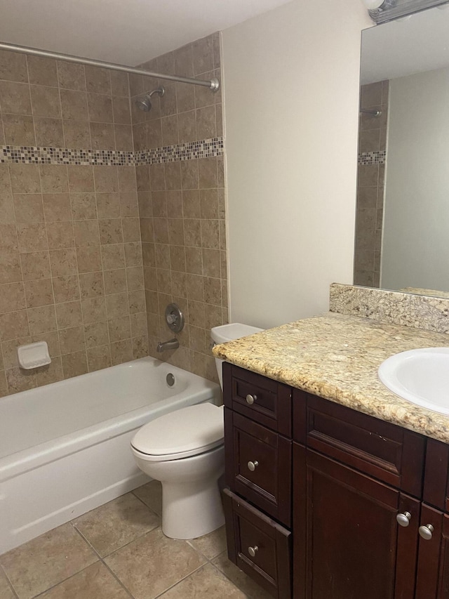 full bath featuring tile patterned flooring, vanity, toilet, and shower / bathing tub combination