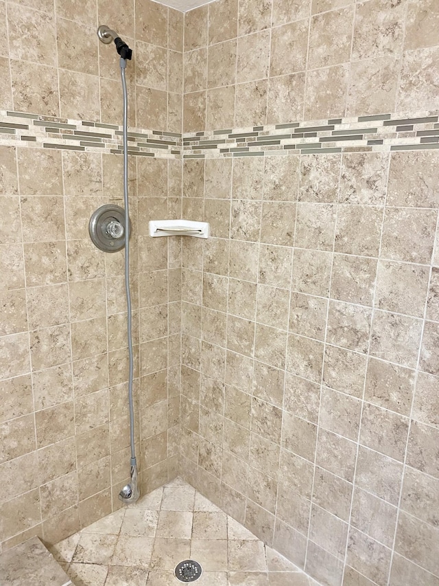 bathroom with tiled shower