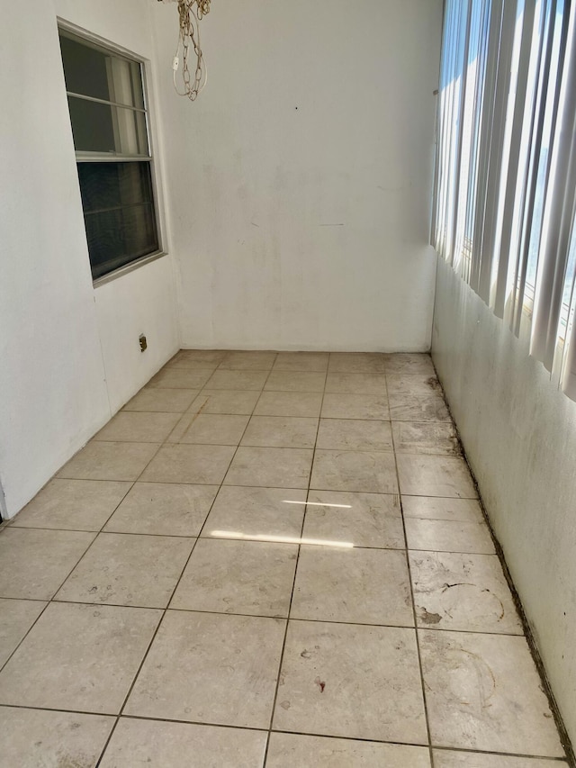 unfurnished room with light tile patterned floors