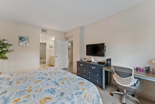 bedroom with visible vents and light wood-type flooring