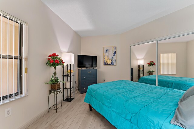 bedroom featuring light wood-style flooring