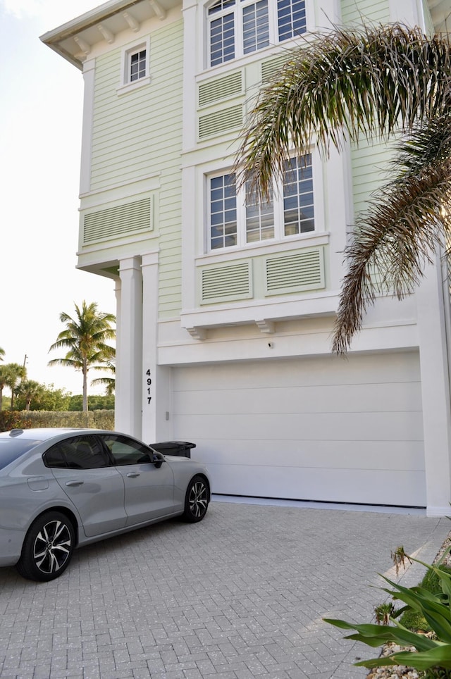 view of front of property with a garage