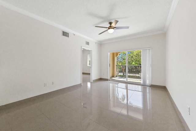 tiled empty room with visible vents, baseboards, a textured ceiling, and ornamental molding