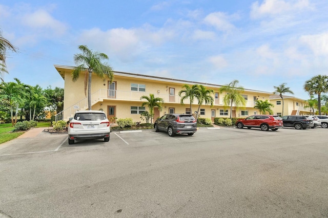 view of property featuring uncovered parking