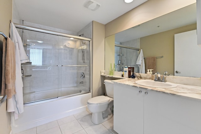 full bathroom featuring visible vents, toilet, tile patterned flooring, enclosed tub / shower combo, and vanity