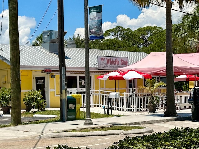 view of building exterior featuring fence