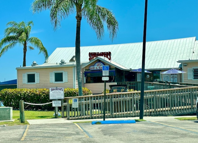 view of building exterior featuring uncovered parking