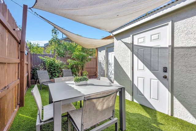 view of patio / terrace with a fenced backyard and outdoor dining space