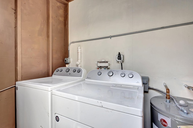 laundry area featuring water heater, laundry area, and washing machine and dryer