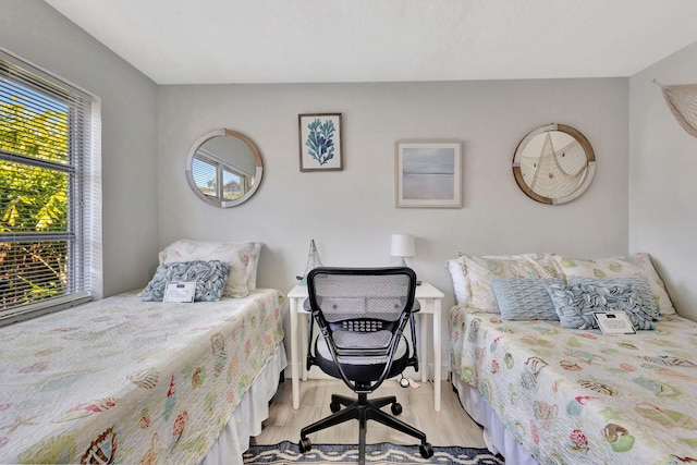 bedroom with light wood-type flooring