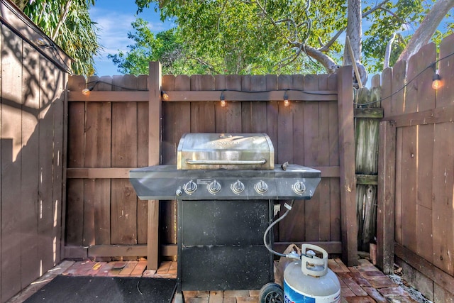 view of patio featuring a grill