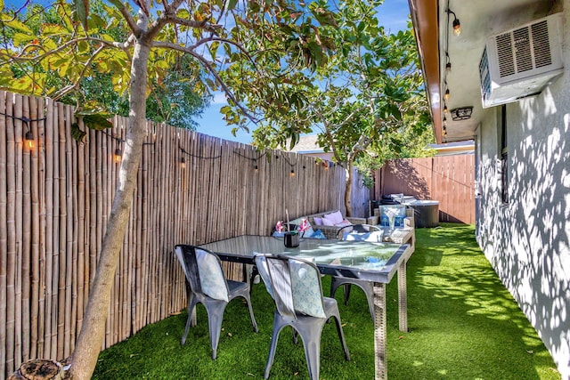 view of patio featuring outdoor dining area and a fenced backyard