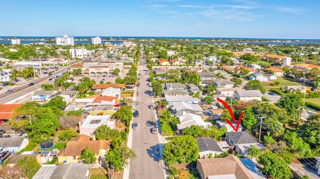 bird's eye view featuring a water view and a residential view