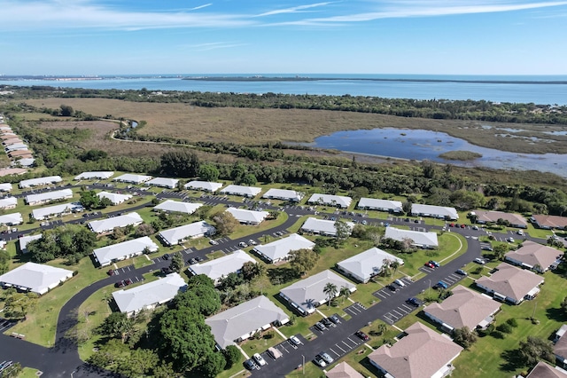 birds eye view of property with a residential view and a water view