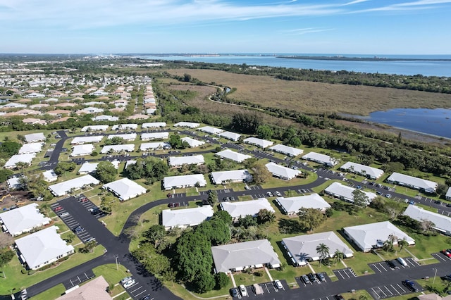 aerial view featuring a water view and a residential view