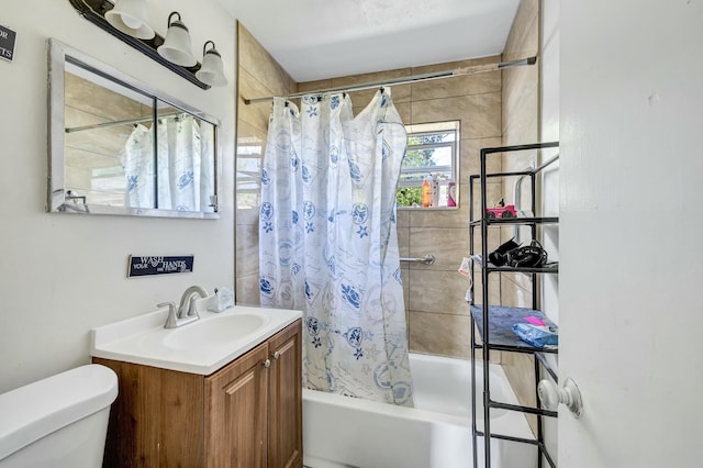 bathroom with vanity, shower / tub combo, and toilet