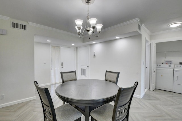 dining area with visible vents, baseboards, washing machine and dryer, and crown molding