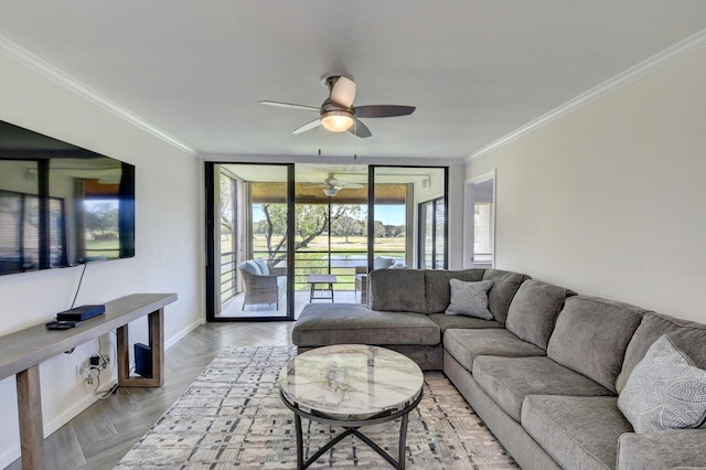 living room featuring a wall of windows, ceiling fan, and ornamental molding