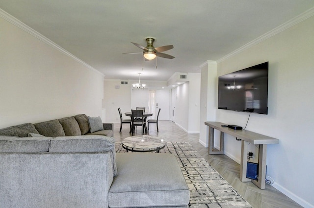 living room featuring crown molding, ceiling fan with notable chandelier, baseboards, and visible vents